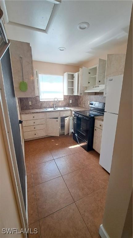 509 W Obispo Ave, Clewiston, FL 33440 - kitchen featuring open shelves, a sink, black range with electric cooktop, backsplash, and under cabinet range hood
