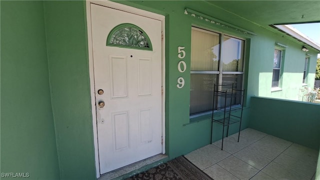 509 W Obispo Ave, Clewiston, FL 33440 - view of exterior entry featuring stucco siding