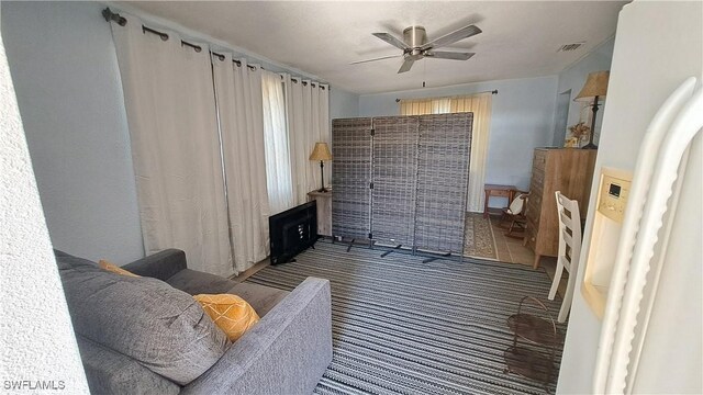 509 W Obispo Ave, Clewiston, FL 33440 - interior space featuring carpet floors, a ceiling fan, and visible vents