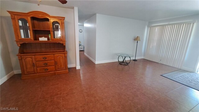 509 W Obispo Ave, Clewiston, FL 33440 - empty room featuring baseboards, ceiling fan, and tile patterned flooring