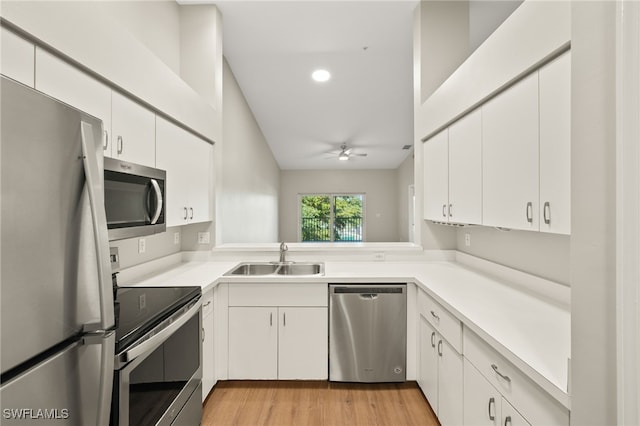 9200 Highland Woods Blvd Unit 1309, Bonita Springs, FL 34135 - kitchen with ceiling fan, white cabinets, light countertops, a sink, and stainless steel appliances