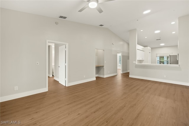 9200 Highland Woods Blvd Unit 1309, Bonita Springs, FL 34135 - unfurnished living room featuring visible vents, light wood-type flooring, a ceiling fan, and lofted ceiling