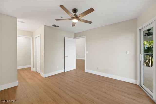 9200 Highland Woods Blvd Unit 1309, Bonita Springs, FL 34135 - unfurnished bedroom featuring visible vents, baseboards, ceiling fan, light wood-type flooring, and access to exterior