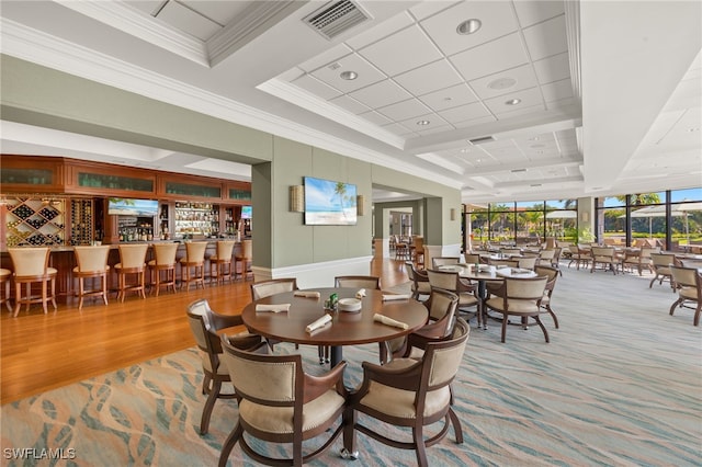 9200 Highland Woods Blvd Unit 1309, Bonita Springs, FL 34135 - dining room with a decorative wall, a community bar, ornamental molding, and visible vents