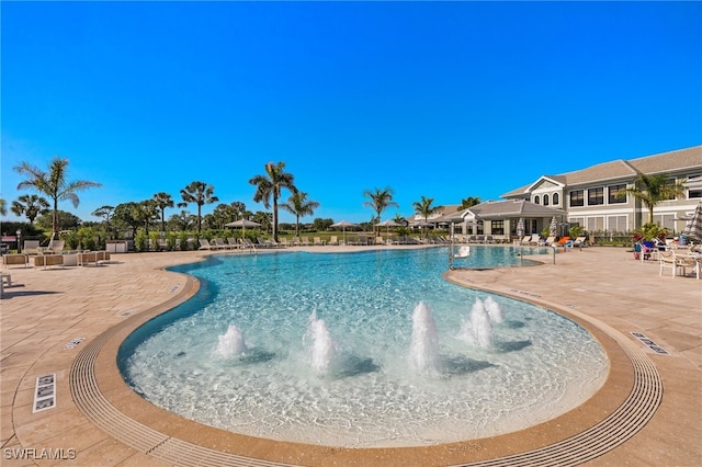 9200 Highland Woods Blvd Unit 1309, Bonita Springs, FL 34135 - community pool featuring a patio