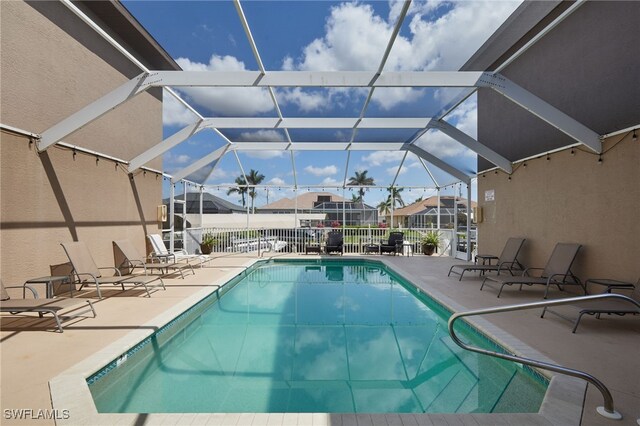 1315 SW 47th Ter Unit 102, Cape Coral, FL 33914 - community pool featuring a patio and a residential view