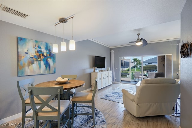 1315 SW 47th Ter Unit 102, Cape Coral, FL 33914 - dining room with baseboards, a ceiling fan, and ornamental molding
