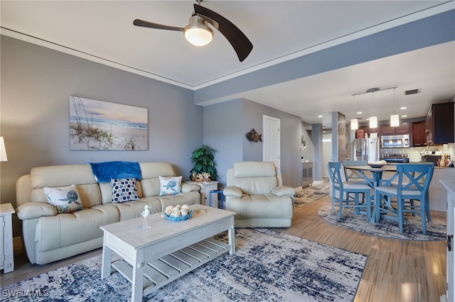1315 SW 47th Ter Unit 102, Cape Coral, FL 33914 - living area featuring ceiling fan and light wood-style flooring