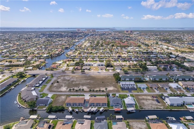 1315 SW 47th Ter Unit 102, Cape Coral, FL 33914 - aerial overview of property's location with a nearby body of water and nearby suburban area