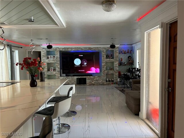 living room featuring a healthy amount of sunlight and marble finish floor