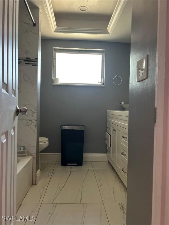 full bath with vanity, marble finish floor, toilet, baseboards, and a raised ceiling