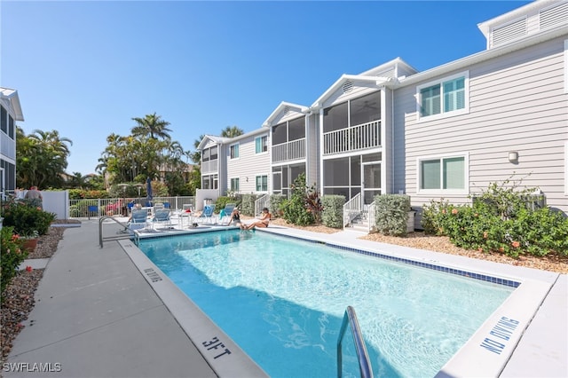 829 W Elkcam Cir Unit 2-106, Marco Island, FL 34145 - community pool featuring a sunroom and a patio area