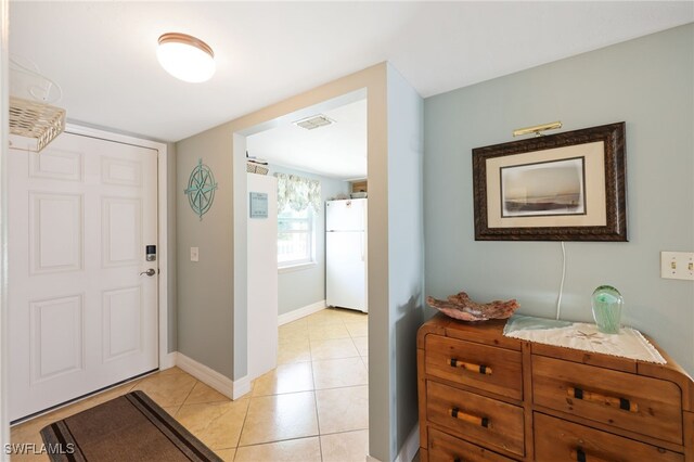 829 W Elkcam Cir Unit 2-106, Marco Island, FL 34145 - foyer entrance featuring light tile patterned floors and baseboards