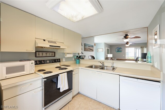 829 W Elkcam Cir Unit 2-106, Marco Island, FL 34145 - kitchen with white appliances, under cabinet range hood, a sink, cream cabinetry, and light countertops