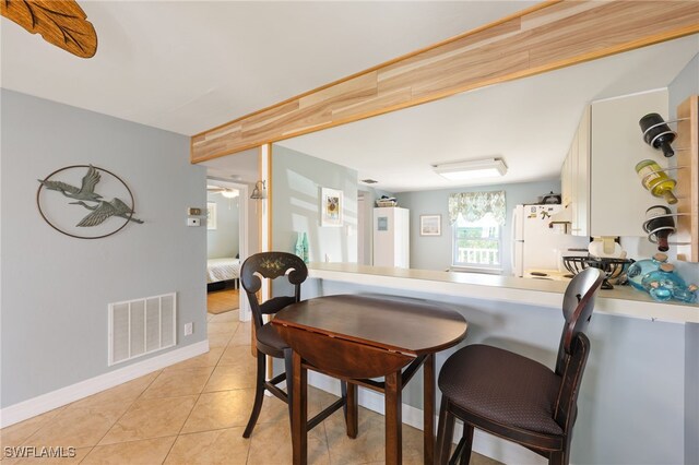 829 W Elkcam Cir Unit 2-106, Marco Island, FL 34145 - dining room featuring light tile patterned floors and baseboards