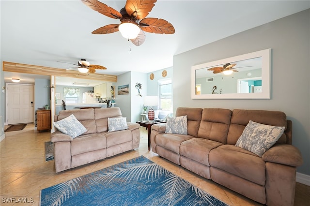 829 W Elkcam Cir Unit 2-106, Marco Island, FL 34145 - living area featuring plenty of natural light, a ceiling fan, and light tile patterned flooring