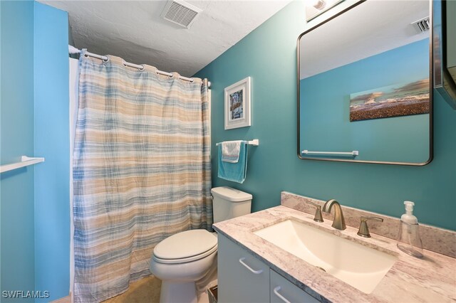 829 W Elkcam Cir Unit 2-106, Marco Island, FL 34145 - bathroom with vanity, toilet, and curtained shower