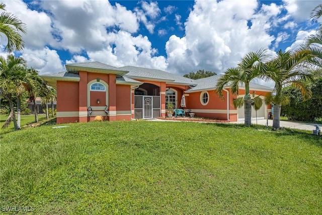 18510 Ellen Ave, Port Charlotte, FL 33948 - exterior space with concrete driveway, a front lawn, a garage, and stucco siding