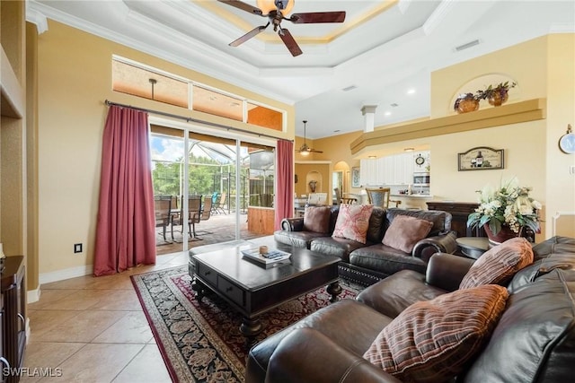 18510 Ellen Ave, Port Charlotte, FL 33948 - living area featuring crown molding, ceiling fan, a tray ceiling, arched walkways, and visible vents