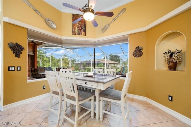 18510 Ellen Ave, Port Charlotte, FL 33948 - tiled dining room with baseboards, a ceiling fan, and a sunroom