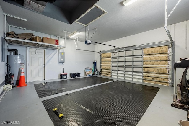 18510 Ellen Ave, Port Charlotte, FL 33948 - garage with water heater, a garage door opener, and electric panel