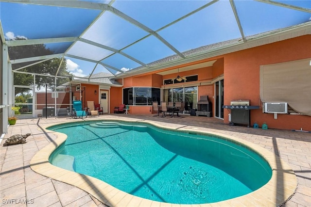 18510 Ellen Ave, Port Charlotte, FL 33948 - outdoor pool featuring a patio, glass enclosure, area for grilling, and ceiling fan