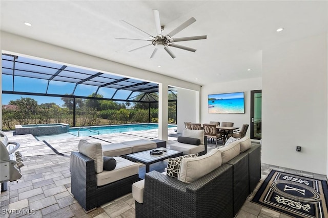 9974 Winterview Dr, Naples, FL 34109 - view of swimming pool with an outdoor hangout area, a ceiling fan, a patio area, a pool with connected hot tub, and outdoor dining area