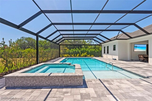 9974 Winterview Dr, Naples, FL 34109 - view of pool with a patio, a pool with connected hot tub, and a lanai