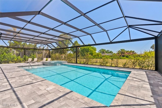 9974 Winterview Dr, Naples, FL 34109 - view of swimming pool with a pool with connected hot tub, a patio, and glass enclosure