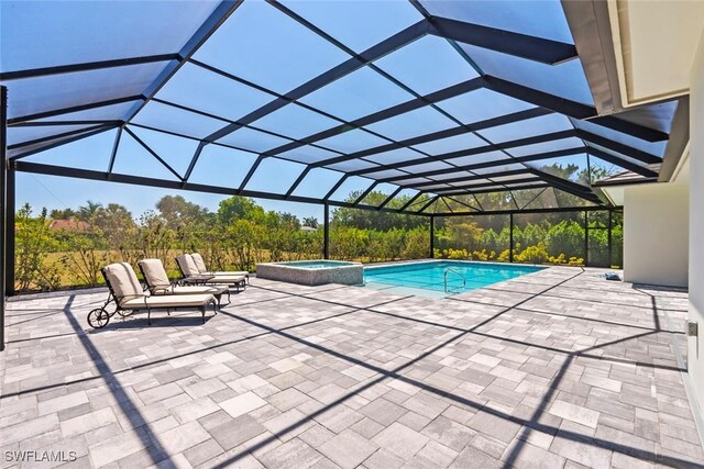 9974 Winterview Dr, Naples, FL 34109 - view of swimming pool with a pool with connected hot tub, a patio area, and glass enclosure