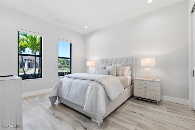 9974 Winterview Dr, Naples, FL 34109 - bedroom with light wood-type flooring, baseboards, and recessed lighting