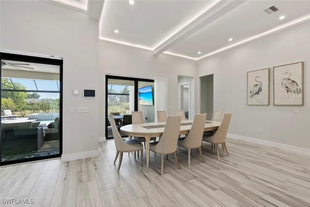 9974 Winterview Dr, Naples, FL 34109 - dining space featuring healthy amount of natural light, light wood-style floors, beamed ceiling, baseboards, and recessed lighting