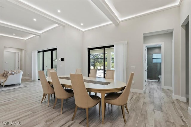 9974 Winterview Dr, Naples, FL 34109 - dining space featuring beamed ceiling, light wood-style floors, baseboards, and recessed lighting