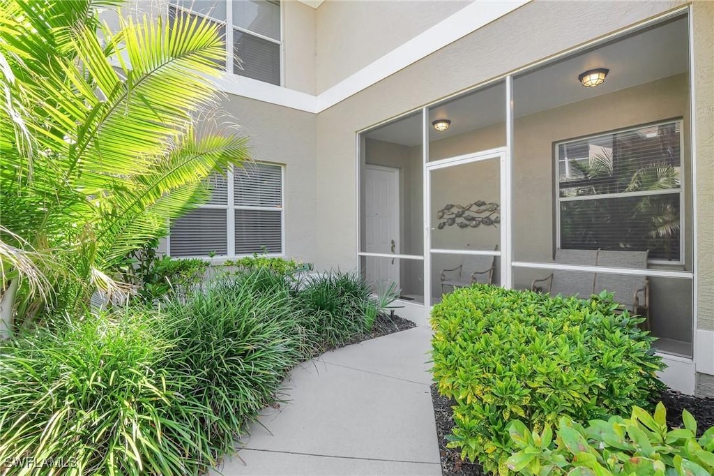 784 Carrick Bend Cir Unit 101, Naples, FL 34110 - property entrance featuring stucco siding