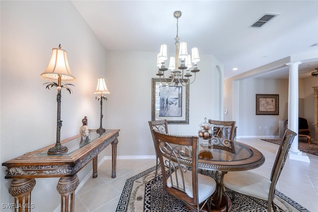4660 Winged Foot Ct Unit 102, Naples, FL 34112 - dining room featuring visible vents, ornate columns, an inviting chandelier, and light tile patterned floors