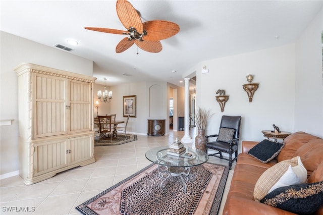 4660 Winged Foot Ct Unit 102, Naples, FL 34112 - living room with baseboards, light tile patterned floors, visible vents, ornate columns, and ceiling fan with notable chandelier