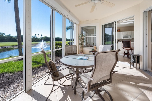 4660 Winged Foot Ct Unit 102, Naples, FL 34112 - sunroom with a water view