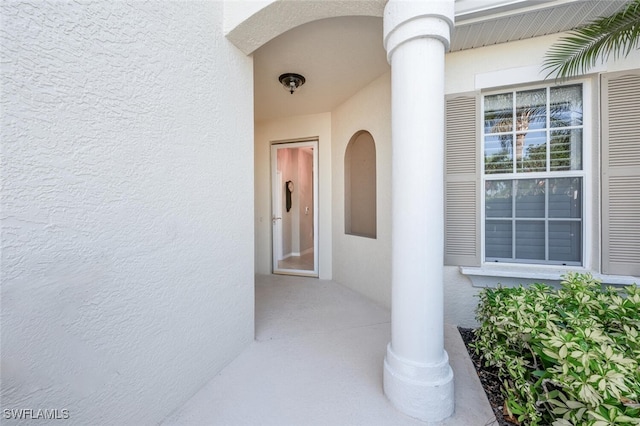 4660 Winged Foot Ct Unit 102, Naples, FL 34112 - doorway to property with stucco siding