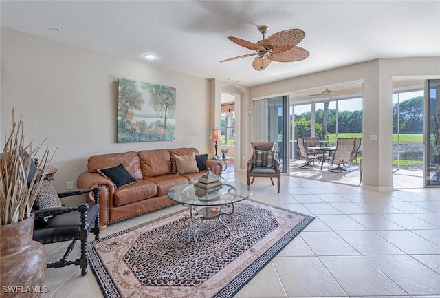 4660 Winged Foot Ct Unit 102, Naples, FL 34112 - living room featuring baseboards, recessed lighting, light tile patterned floors, a ceiling fan, and arched walkways
