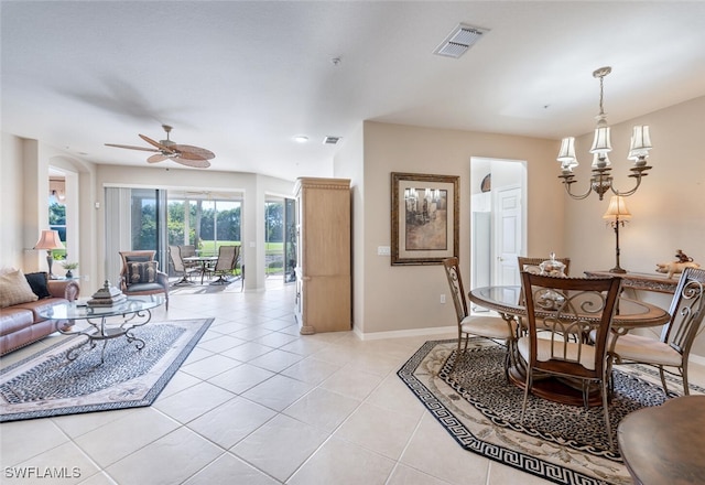 4660 Winged Foot Ct Unit 102, Naples, FL 34112 - dining room with ceiling fan with notable chandelier, light tile patterned floors, baseboards, and visible vents