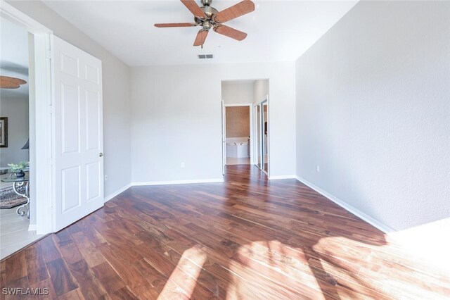 4660 Winged Foot Ct Unit 102, Naples, FL 34112 - unfurnished bedroom featuring visible vents, baseboards, a ceiling fan, and wood finished floors