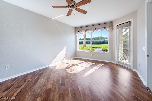 4660 Winged Foot Ct Unit 102, Naples, FL 34112 - unfurnished room with ceiling fan, baseboards, and dark wood-style floors
