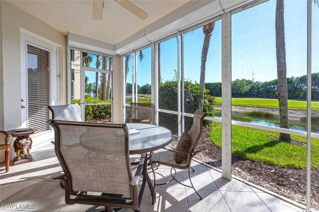 4660 Winged Foot Ct Unit 102, Naples, FL 34112 - sunroom with a water view