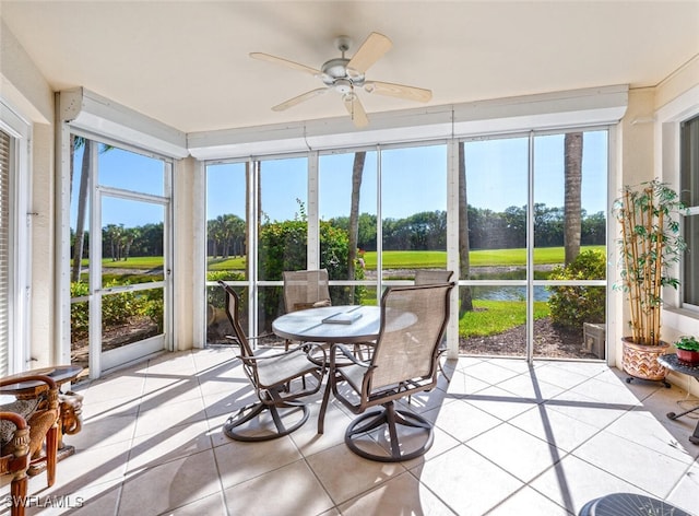 4660 Winged Foot Ct Unit 102, Naples, FL 34112 - sunroom featuring a water view, ceiling fan, and outdoor dining space