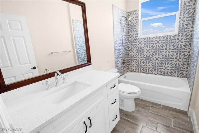 4911 Bywood St, Lehigh Acres, FL 33971 - bathroom featuring vanity, toilet, shower / tub combination, and wood tiled floors