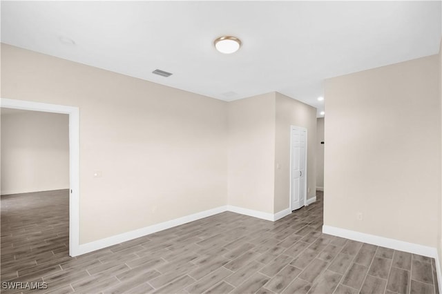 4911 Bywood St, Lehigh Acres, FL 33971 - unfurnished room with wood finished floors, baseboards, and recessed lighting