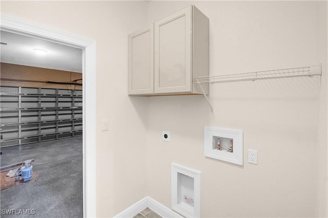 4911 Bywood St, Lehigh Acres, FL 33971 - laundry room featuring cabinet space, hookup for an electric dryer, hookup for a washing machine, and baseboards