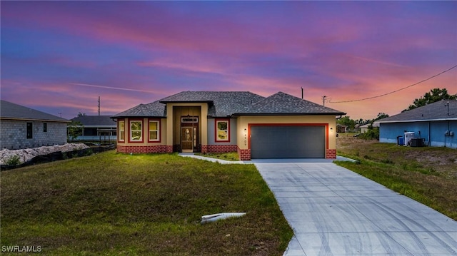 4909 Berryman St, Lehigh Acres, FL 33971 - prairie-style home featuring central AC unit, stucco siding, an attached garage, driveway, and a front yard