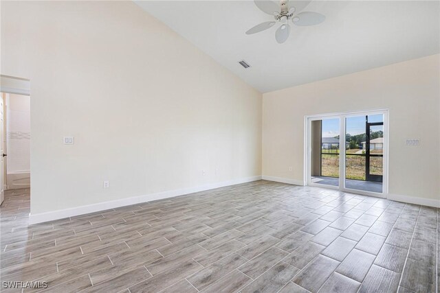 4909 Berryman St, Lehigh Acres, FL 33971 - spare room with light wood finished floors, baseboards, a ceiling fan, and high vaulted ceiling