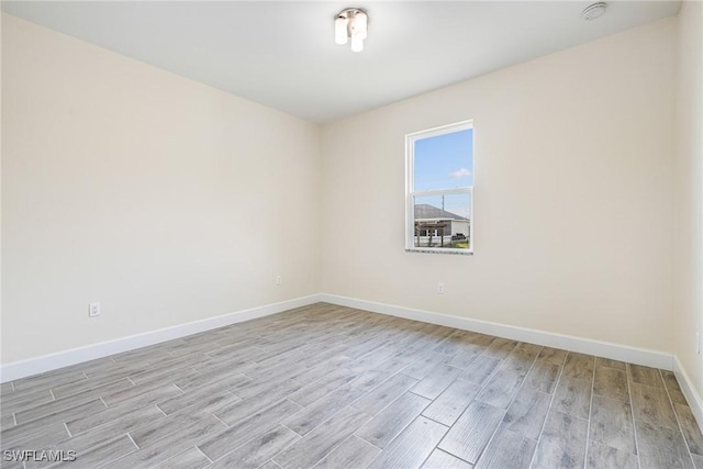 4909 Berryman St, Lehigh Acres, FL 33971 - unfurnished room featuring light wood-style flooring and baseboards